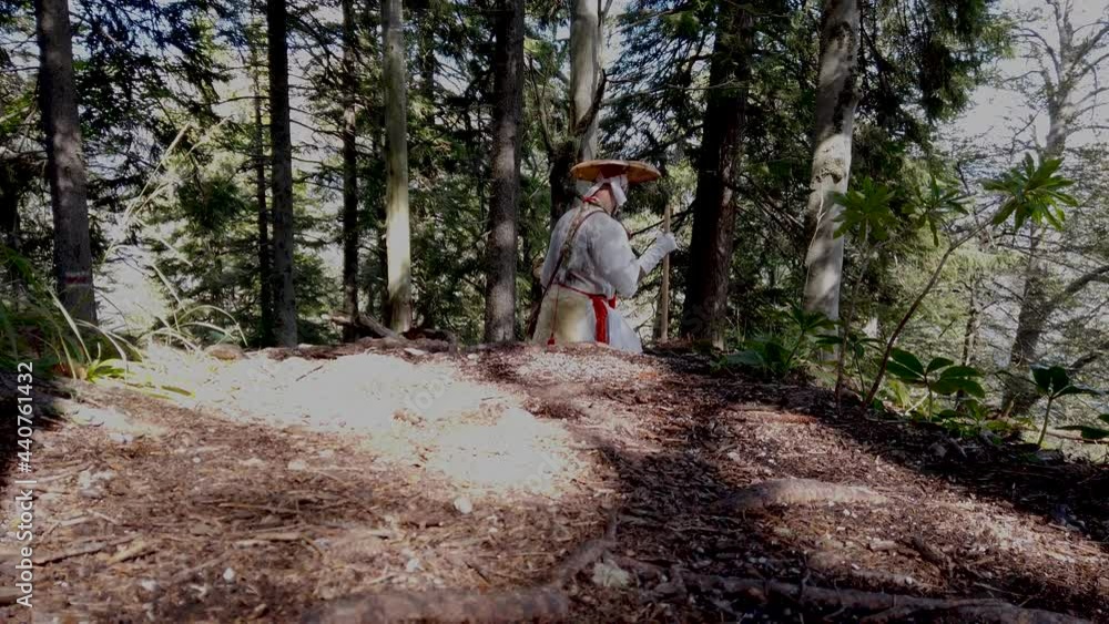 European Shugendo monk in traditional outfit hiking in the Austrian mountains, Austrian, Ötscher European Shugendo monk in traditional outfit hiking in the Austrian mountains, Austrian, Ötscher