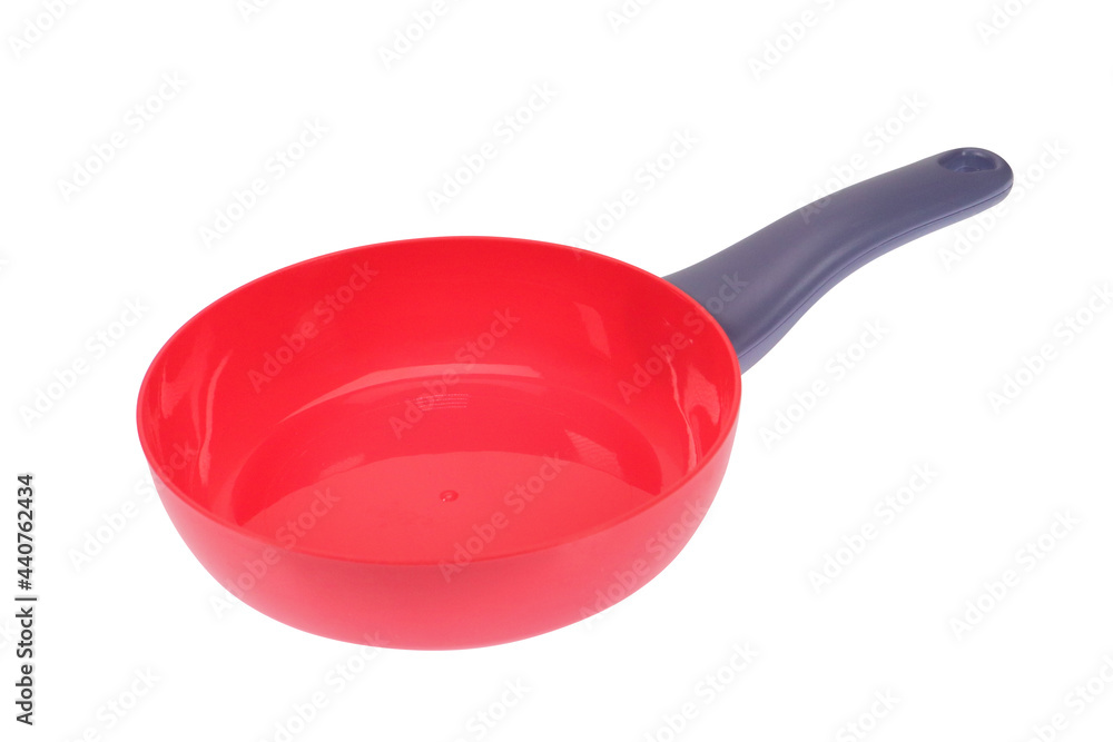 Red empty frying pan with a gray handle, on a white background, isolated image Red empty frying pan with a gray handle, on a white background, isolated image