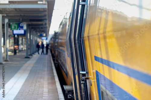 Selective focus of the train with blurred peoples traveling with the train as background, Passenger getting in and out the train in Netherlands.  