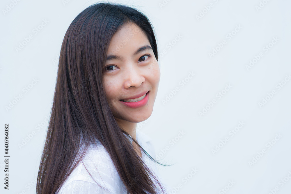 close up attractive adult business woman asian girl with happy and smile against white concrete wall office. close up attractive adult business woman asian girl with happy and smile against white concrete wall office.