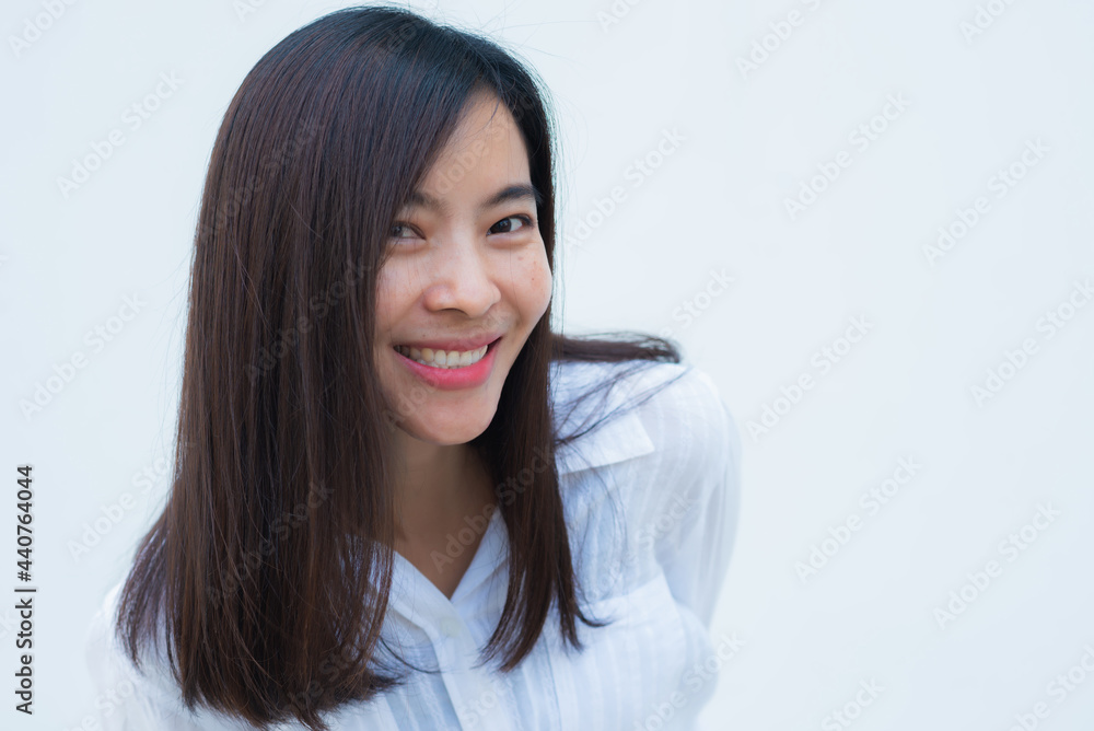 close up attractive adult business woman asian girl with happy and smile against white concrete wall office. close up attractive adult business woman asian girl with happy and smile against white concrete wall office.
