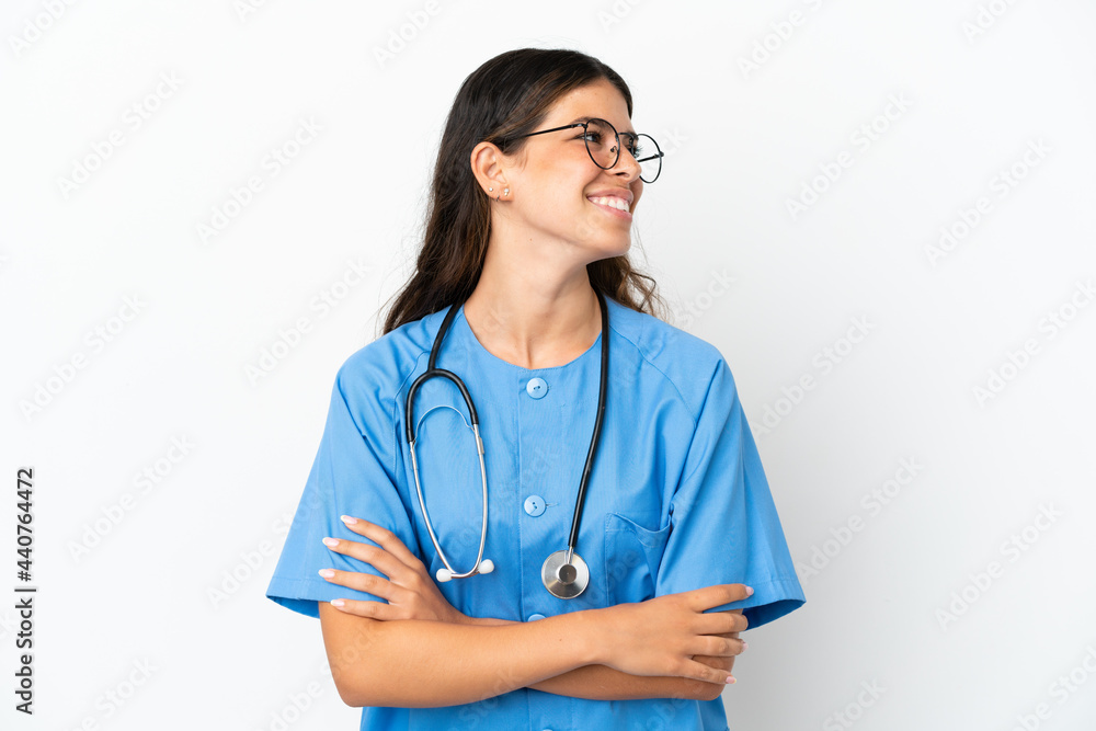 Young surgeon doctor caucasian woman isolated on white background looking side Young surgeon doctor caucasian woman isolated on white background looking side