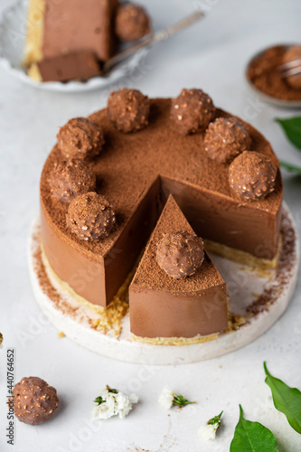 Cold chocolate cheesecake with truffle and cocoa powder