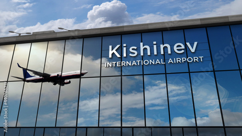 Airplane landing at Kishinev, Chisinau Moldova airport mirrored in terminal