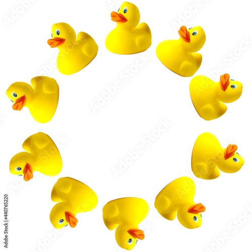 Rubber ducks isolated on white background in the form of a round frame. Toy animal. Template for design and print
