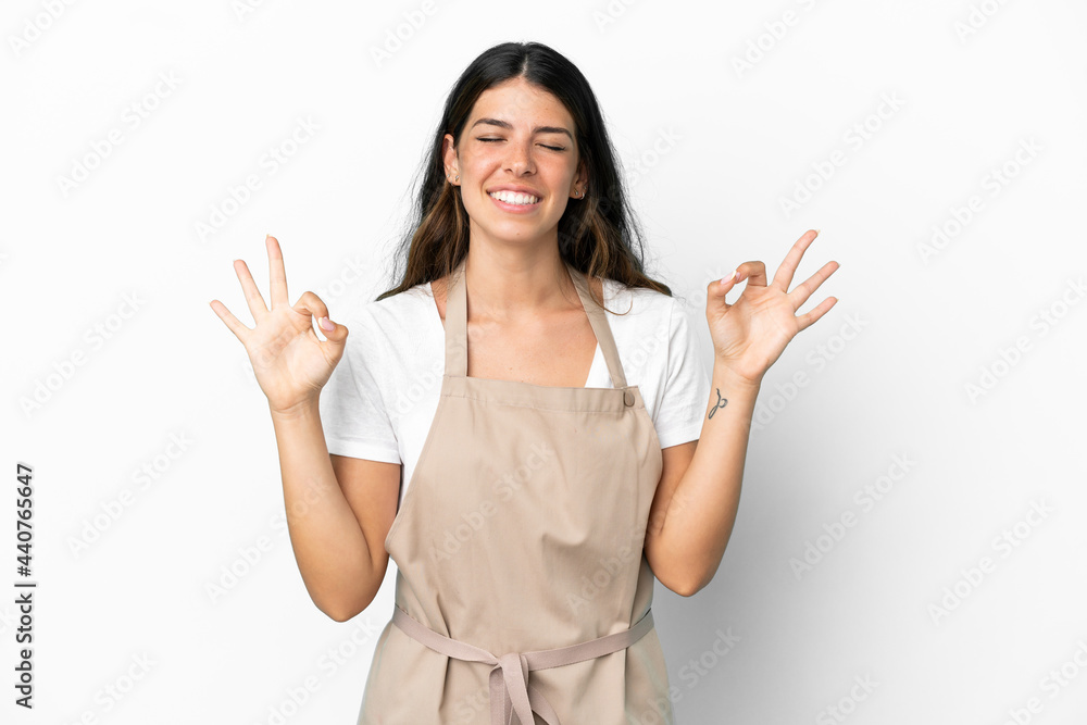 Restaurant waiter over isolated white background in zen pose Restaurant waiter over isolated white background in zen pose
