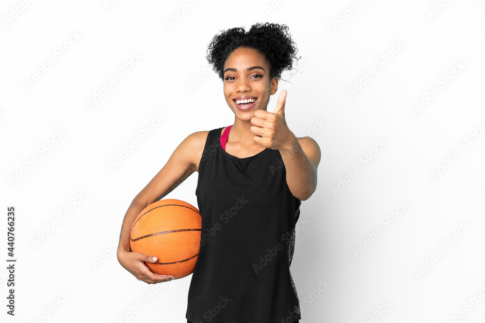 Young basketball player latin woman isolated on white background with thumbs up because something good has happened