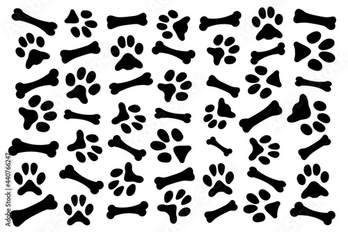 Wallpaper with lots of dog bones and dog footprints. Dog wallpaper.