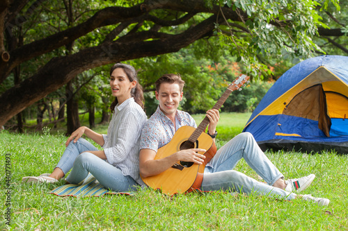 Sweet couple relaxing on picnic in park, beautiful lover spending time together and having romantic moment  © photofriday