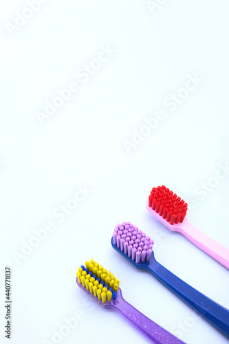 Brushes for cleaning teeth and braces. Assortment of toothbrushes. Top view. Vertical photo.