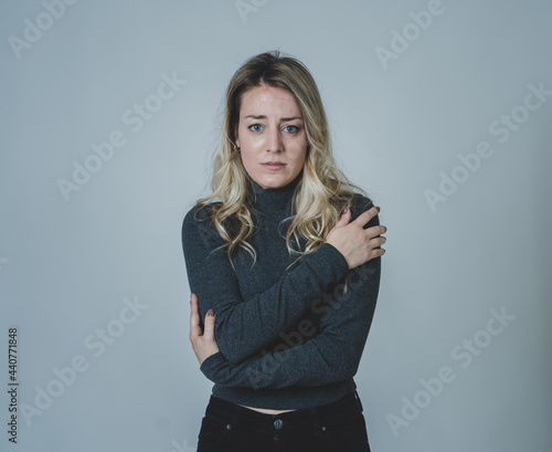 Portrait of young attractive caucasian woman suffering from depression, stress and anxiety. Sad and lonely woman crying, feeling depressed, distressed, worried and overwhelmed. Mental Health care.