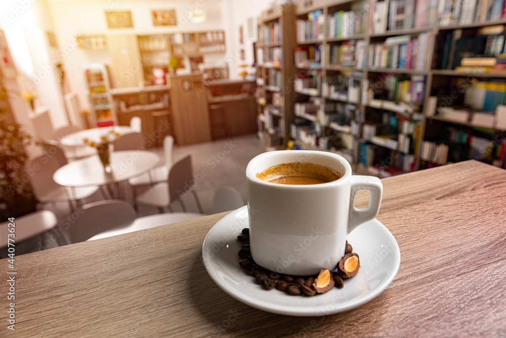 Fototapeta premium White cup of coffee with a saucer