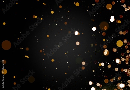 Glittering gold stars of bokeh use for celebrating on a dark background