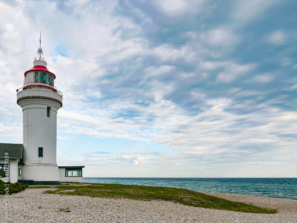 The lighthouse on the beach. The Lighthouse - Sletterhage fyr was built in 1894 and is still working in Denmark today