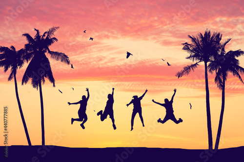 Silhouette happy friends jumping on sunset sky at tropical beach with palm tree and birds flying abstract background. Copy space of feel good freedom and travel adventure concept.