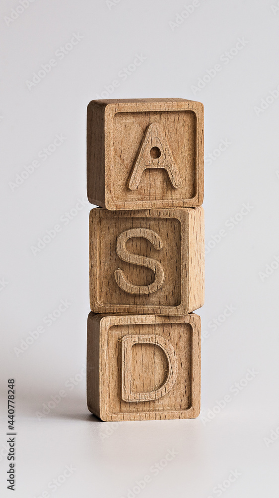 vertical photo on ASD (autism spectrum disorders) theme. wooden cubes ...