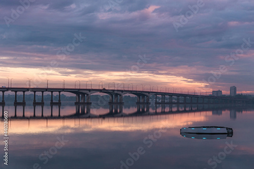 Wallpaper Mural Bridge over the water during beautiful sunset and sunrise sun. Sunset over the bridge, purple blue yellow orange sky. Torontodigital.ca