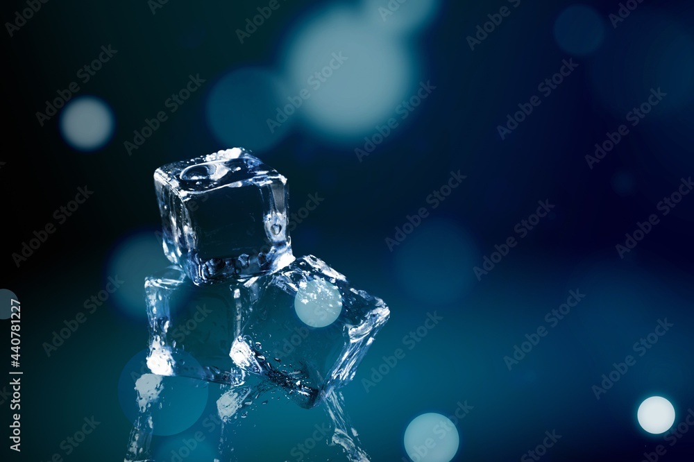 Crystal clear natural ice block on a dark surface. Crystal clear natural ice block on a dark surface.
