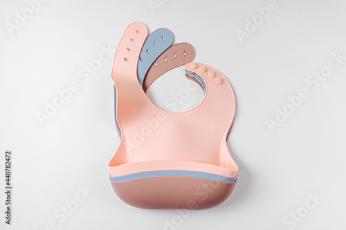 Set of silicone baby bibs. Nutrition and feeding concept. Top view, flat lay