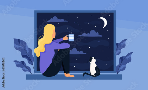 Young cute girl with cat sitting
