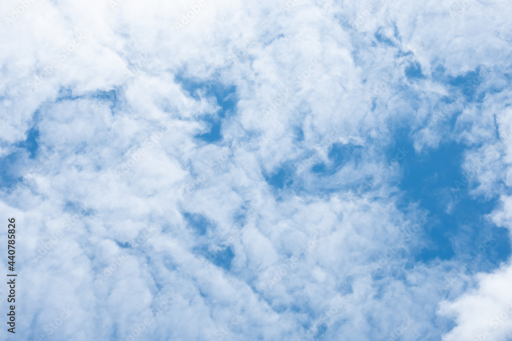 Blue sky and clouds that look like white paint on a blue background. Blue sky and clouds that look like white paint on a blue background.