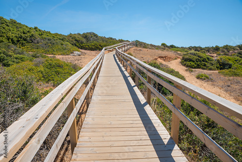 wooden boardwalk in dune landscape, West Algarve Portugal