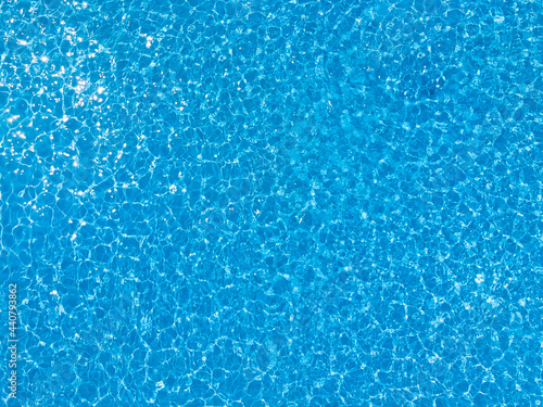 Blue ripped water in swimming pool. water surface background. summer background