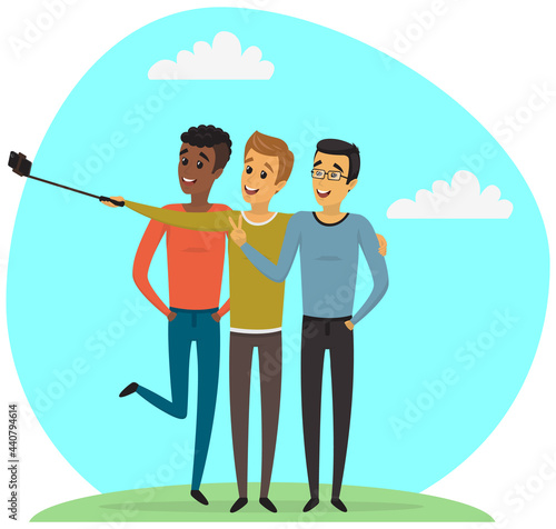 Group of male friends taking selfie photo with smartphone. Young people having fun and making selfie. Friendship and technology concept. Men with phone on monopod are posing for joint photo