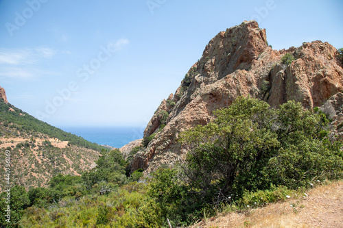Red rock formations at the "Rocher de Saint Barthelemy" on the Corniche d'or on the french riviera.