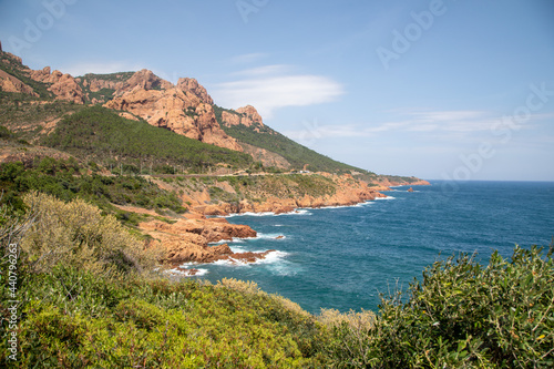 The coastline of the "Corniche d'Or" near Saint Raphael, France, showing the red rock formations of the "Massif de l'Esterel".