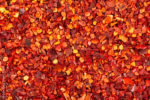 Obraz na płótnie Dried red chili flakes with seeds background