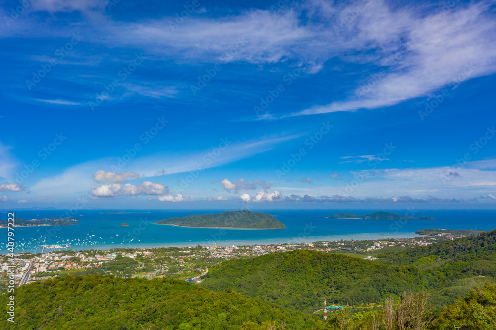 aerial panorama view Chalong gulf in blue sea. Loan island is close to Chalong pier..Houses, buildings of Phuket Town.