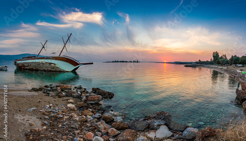 Fototapeta Naklejka Na Ścianę i Meble -  Sunked yacht during sunset in Didim