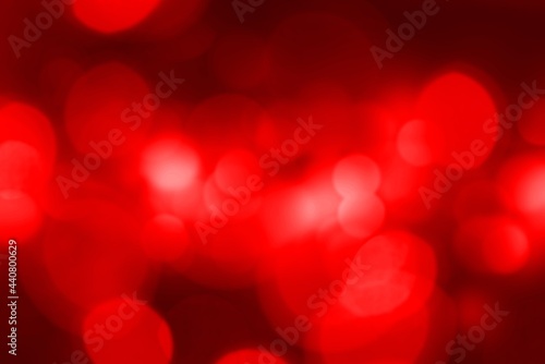 Beautiful red bokeh of lights on dark background