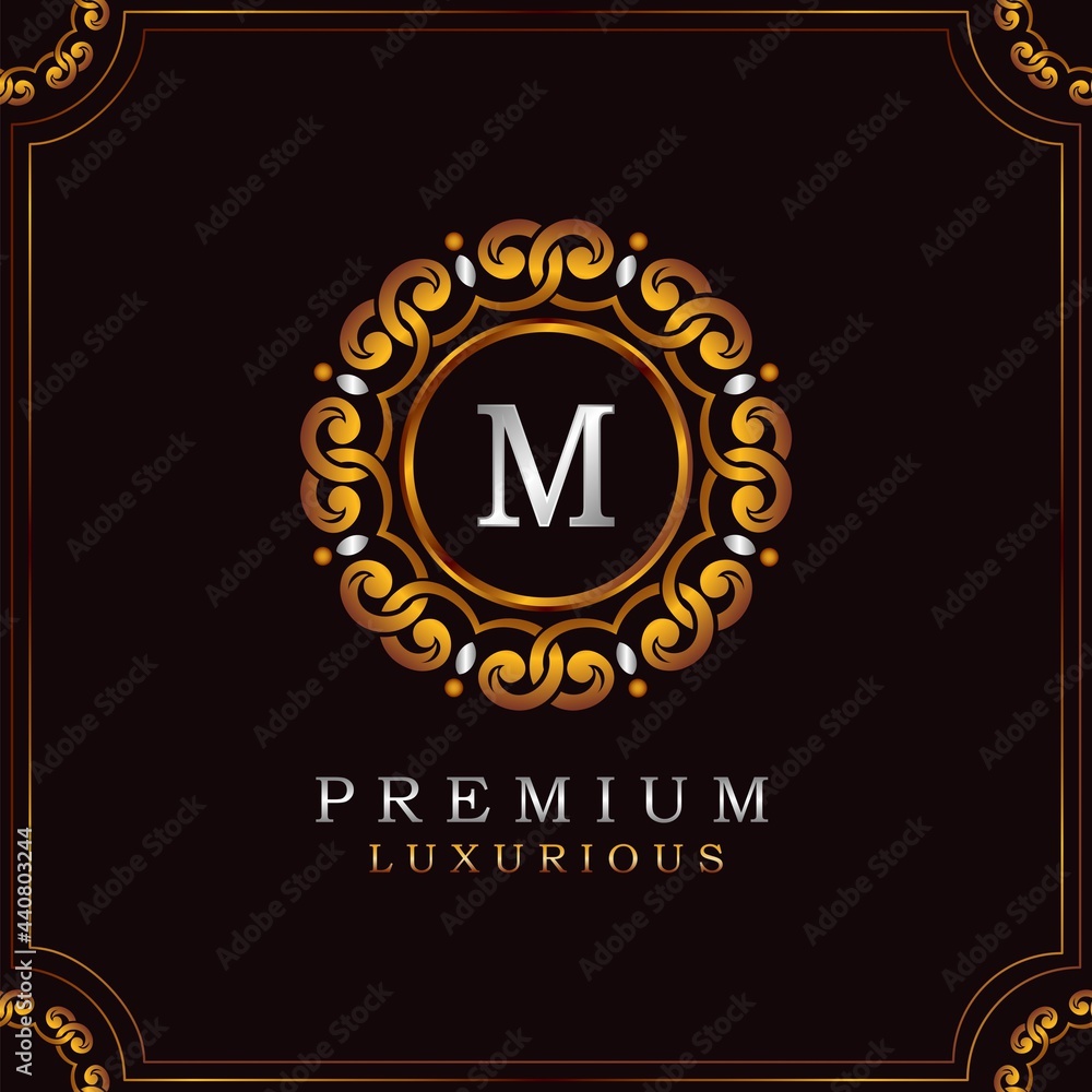 Fototapeta premium Golden Premium Luxury Mandala Badge Letter M Logo Design. Elegance Ornate Decoration Mandala Badge On Golden Frame .