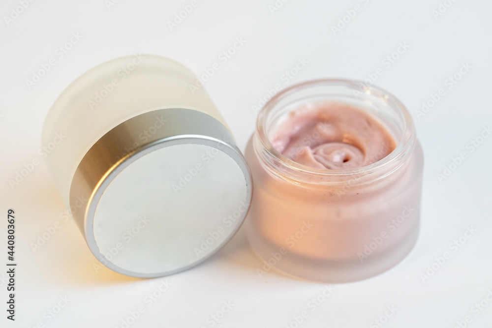 Cream in a jar on a white background Cream in a jar on a white background