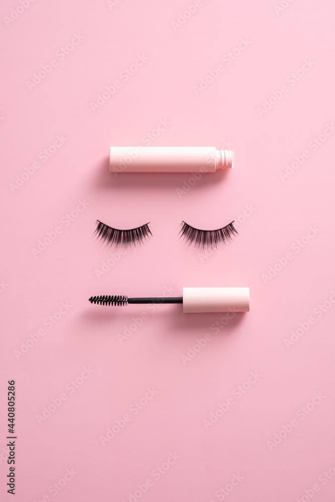 Creative flatlay composition with mascara and false eyelashes on pink  background. Makeup cosmetics set. Stock Photo | Adobe Stock