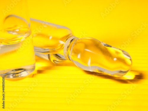 banner several ampoules on a yellow background. © byallasaa