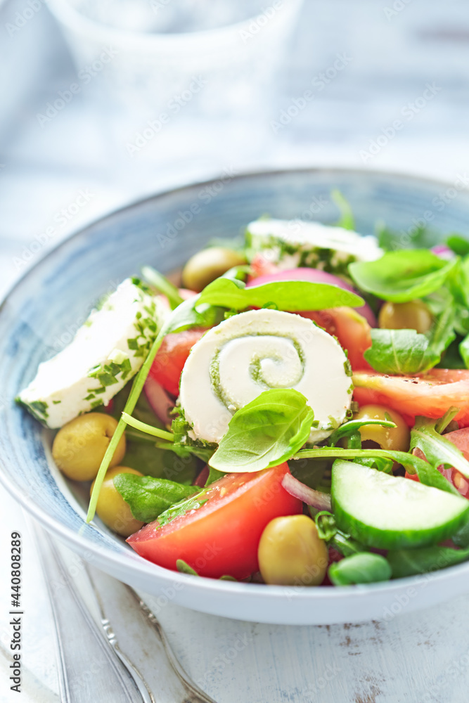 Summer Salad with Cream Cheese, green Olives, Tomatoes and fresh Basil. Bright wooden background. Close up. Summer Salad with Cream Cheese, green Olives, Tomatoes and fresh Basil. Bright wooden background. Close up.