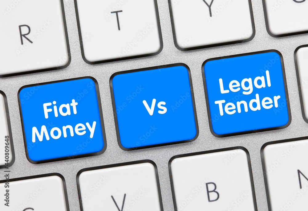 Fiat Money vs. Legal Tender - Inscription on Blue Keyboard Key. Fiat Money vs. Legal Tender - Inscription on Blue Keyboard Key.