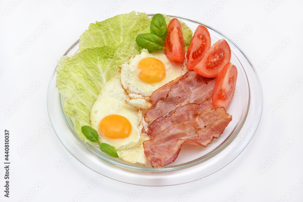nutritious breakfast scrambled eggs with bacon and vegetables on a plate nutritious breakfast scrambled eggs with bacon and vegetables on a plate