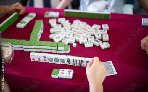 People playing mahjong traditional Chinese board game