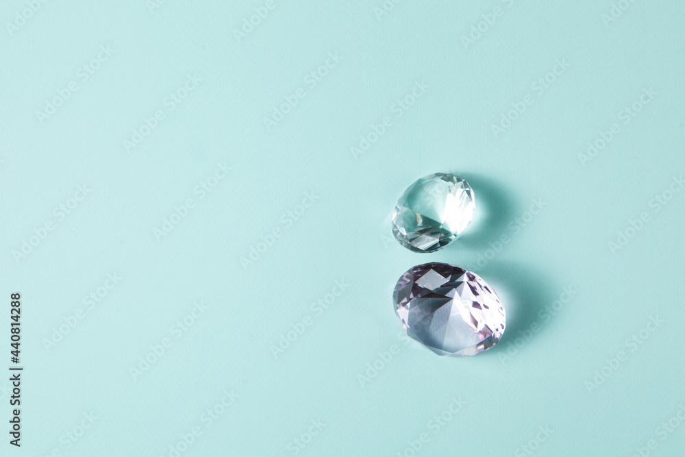 Precious gemstones for design gems jewellery. Diamonds crystal on turquoise background. Precious gemstones for design gems jewellery. Diamonds crystal on turquoise background.
