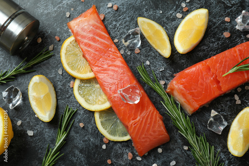 Concept of cooking salmon on black smokey background