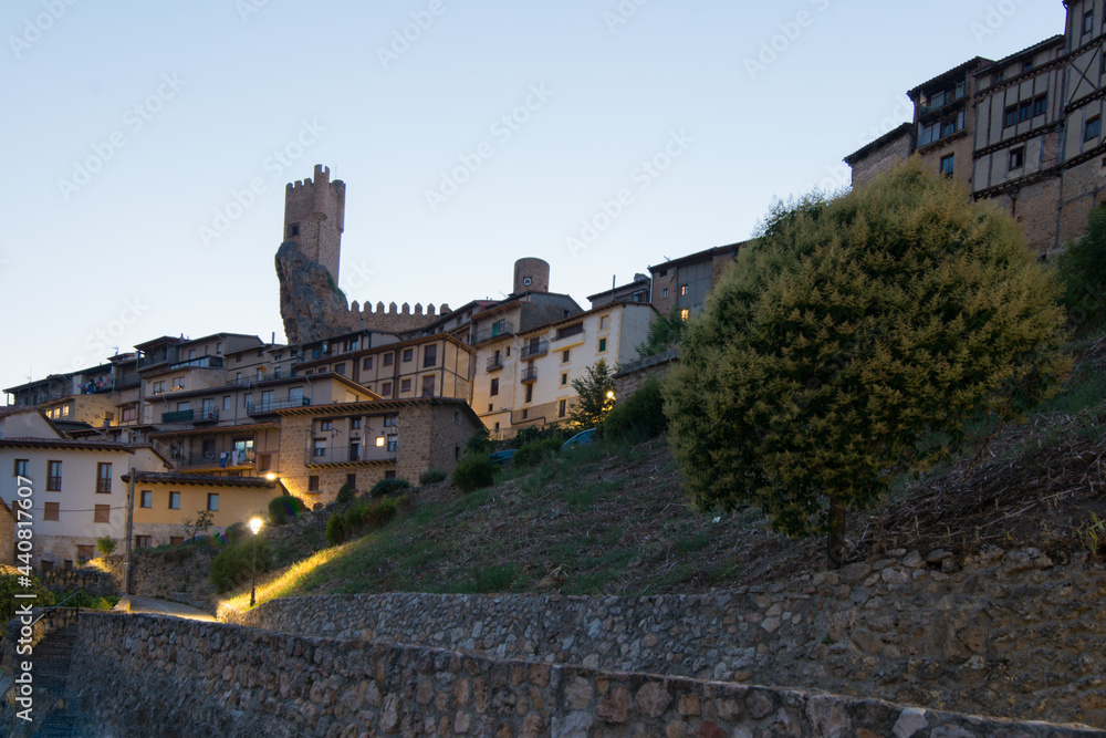 Beautiful view of Frias castle and houses at sunset. Seen from the low part of the town. Burgos, Merindades, Spain Beautiful view of Frias castle and houses at sunset. Seen from the low part of the town. Burgos, Merindades, Spain