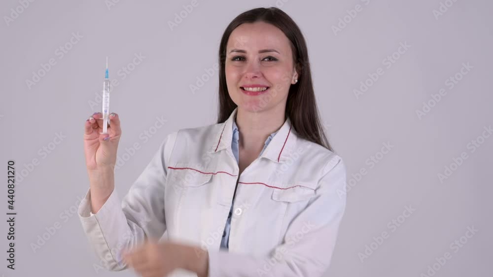 Female Doctor in medical Uniform medical doctor holding syringe and vaccine isolated on white background. Health and medical concepts. Female Doctor in medical Uniform medical doctor holding syringe and vaccine isolated on white background. Health and medical concepts.
