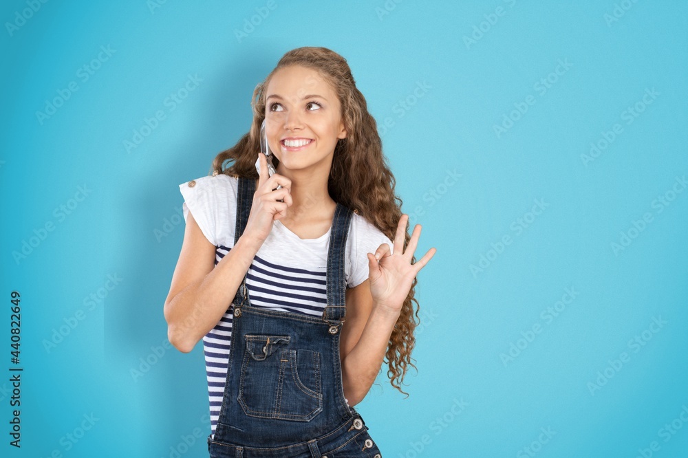 Young happy woman enjoys mobile communication and modern technologies Young happy woman enjoys mobile communication and modern technologies