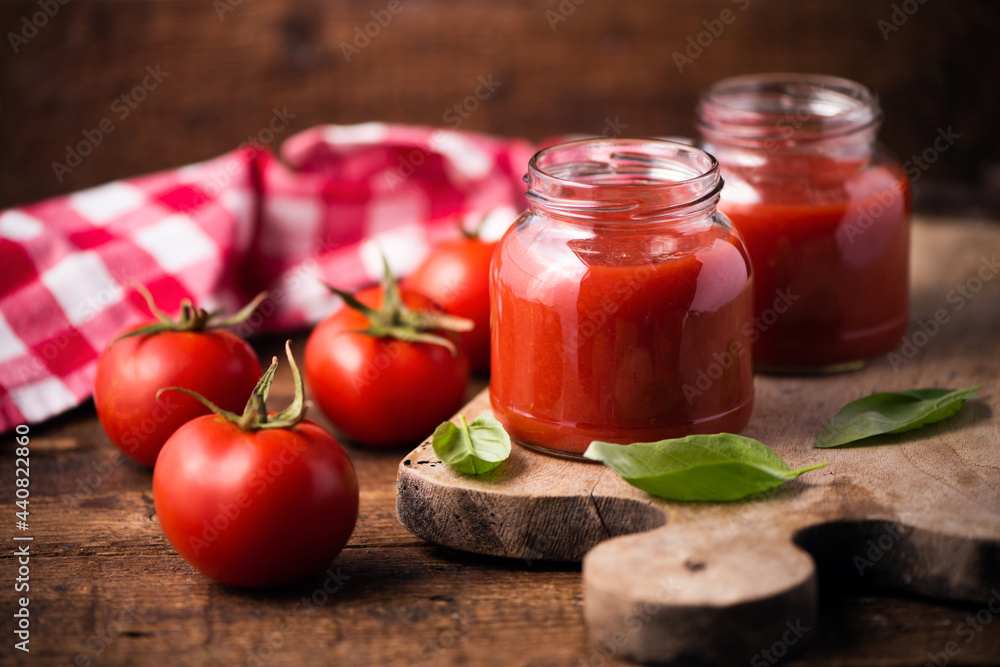 Traditional homemade tomato sauce and tomatoes Traditional homemade tomato sauce and tomatoes