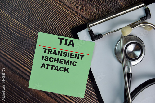 TIA - Transient Ischemic Attack write on sticky notes isolated on Wooden Table. medical concept