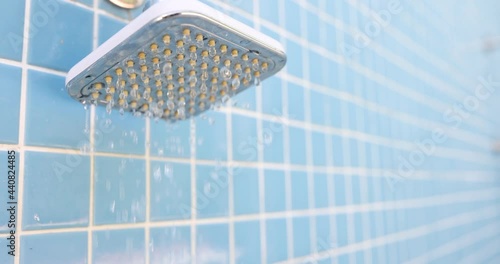 Cold water drips from tap in shower 4k movie photo